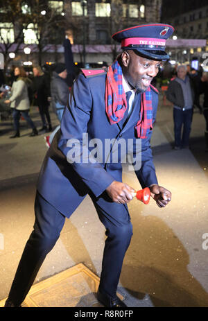 Salvation Army soldier performs for collections in midtown Manhattan Stock Photo