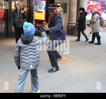 Salvation Army soldier performs for collections in midtown Manhattan Stock Photo