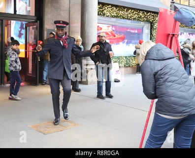 Salvation Army soldier performs for collections in midtown Manhattan Stock Photo