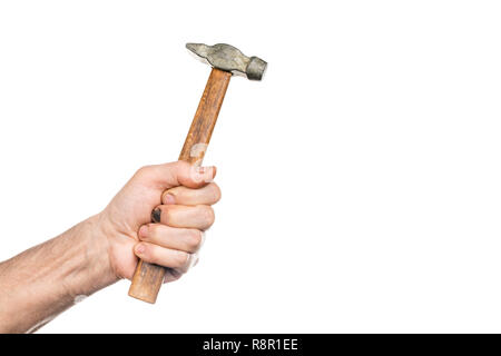 Male hand with black broken nail holds old hammer isolated on white background Stock Photo
