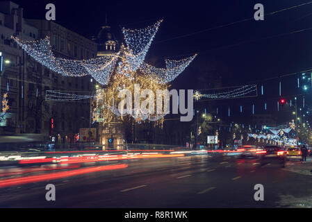 13 DEC 2018, Romania, Bucharest. Rich Christmas decoration at Bulevardul Nicolae Balcescu in Bucharest. Long exposure image. Selective focus Stock Photo