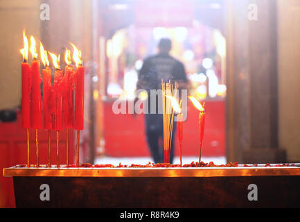 Candles and incenses in shrine temple in chinatown,chinese new year theme Stock Photo