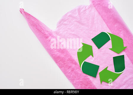 You can make this world better. Recycle symbol at pink plastic bag Stock Photo