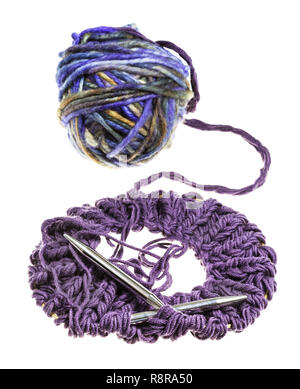 knitted fabric for snood scarf with knitting needles and ball of motley yarn isolated on white background Stock Photo