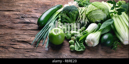 Fresh green vegetables on wooden table. Top view  with copy space Stock Photo