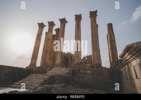 Temple of Artemis in the ancient Roman city of Gerasa preset-day Jerash, Jordan. High columns of the Roman era against the blue sky. Ancient ruins in  Stock Photo