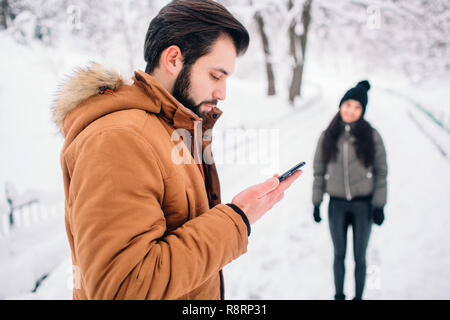 Phone dependency. Winter concept Stock Photo