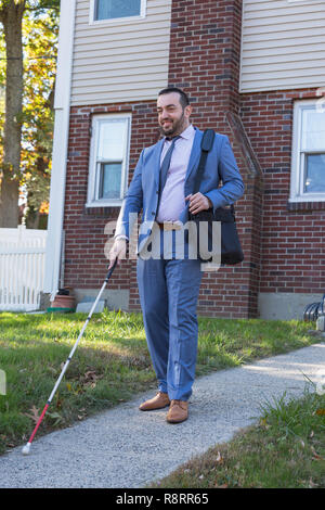Businessman with Visual Impairment outside with his cane Stock Photo
