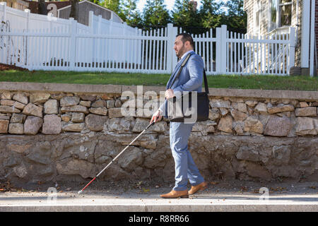 Businessman with Visual Impairment outside with his cane Stock Photo