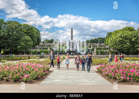 Oslo, Norway - June 5th 2018 - Families walking through a colorful garden in the The Vigeland Park in Oslo, Norway Stock Photo