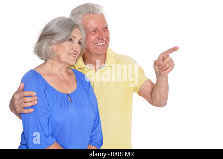 Senior couple pointing isolated on white background Stock Photo