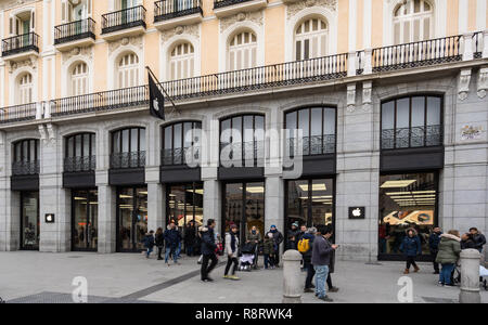 Madrid, Spain - December 2018: Apple Store located in puerta del Sol, with pedestrians passing by outside the store. Stock Photo