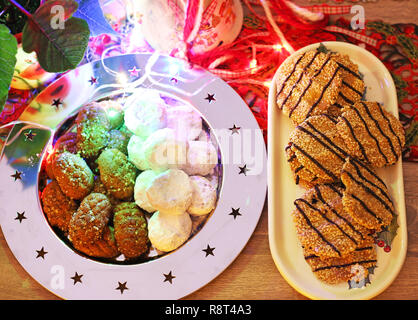 traditional Christmas cookies, greek melomakarona and kourabies on the table - festive Christmas home decoration Stock Photo