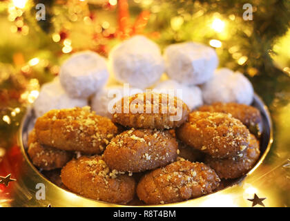 greek melomakarona and kourabies - traditional Christmas cookies with honey and nuts and sugar buns Stock Photo