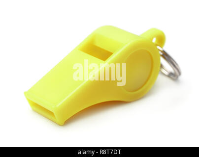 Yellow plastic whistle isolated on white Stock Photo