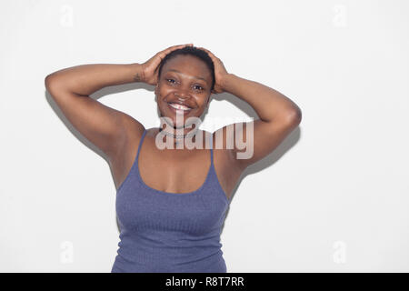 Portrait confident, carefree woman with hands behind head Stock Photo
