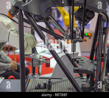 CMM Coordinate Measuring Machine work with robotic arm loading wokpiece Stock Photo