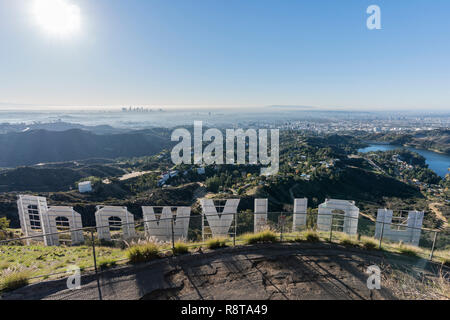 Los Angeles, California, USA - December 13, 2018:  Sunny morning cityscape view from behind the Hollywood sign in popular Griffith Park.