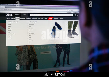 London, UK. 17th Dec, 2018. A woman is seen shopping on ASOS the online fashion store on a desktop. Shares in Asos tumbled nearly 40 per cent on Monday morning after the online fashion retailer warned of weak profits this financial year after ''unprecedented'' discounting hit its trading in November. Credit: Dinendra Haria/SOPA Images/ZUMA Wire/Alamy Live News Stock Photo