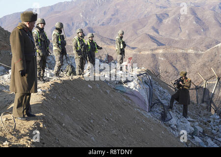Cheorwon, South Korea. 17th Dec, 2018. In this photo provided by South Korea Defense Ministry, South Korean and North Korean army soldiers inspect the dismantled North Korean guard post inside the Demilitarized Zone (DMZ) in the central section of the inter-Korean border in Cheorwon, North Korea. South Korea's military on Monday confirmed the demolition and disablement of some North Korean border guard posts (GPs) through its onsite verification last week and days of subsequent analysis. Credit: Korean Pool/ZUMA Wire/Alamy Live News Stock Photo