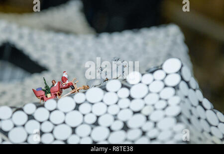 Hamburg, Germany. 17th Dec, 2018. A 1:96 model of a Santa Claus with a sleigh stands on the roof of the Model Elphilharmonie in Miniatur Wunderland. Credit: Axel Heimken/dpa/Alamy Live News Stock Photo