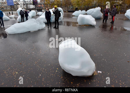 Tate Modern, London, UK. 18th Dec, 2018. 'Ice Watch', an ice block installation by Olafur Eliasson and Minik Rosing outside the Tate Modern in London. Twenty four blocks of ice from the Nuup Kangerlua fjord in Greenland after becoming detached from the ice sheet. As a result of global warming more icebergs are being produced, and contributing to rising sea levels. Credit: Matthew Chattle/Alamy Live News Stock Photo
