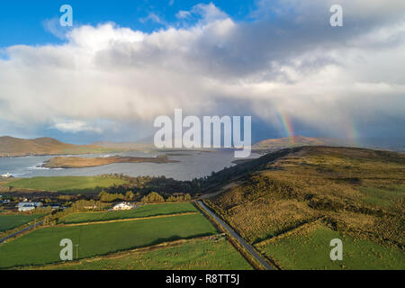 Dramatic clouds and double rainbow, over Valentia Island County Kerry, Ireland Stock Photo