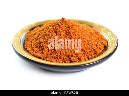 Coconut sugar, also known as coco sugar, coconut palm sugar, coco sap sugar or coconut blossom. Isolated on white background. Stock Photo