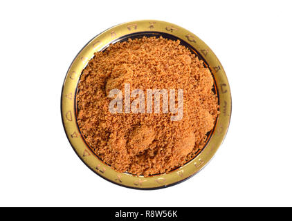 Coconut sugar, also known as coco sugar, coconut palm sugar, coco sap sugar or coconut blossom. Isolated on white background. Stock Photo