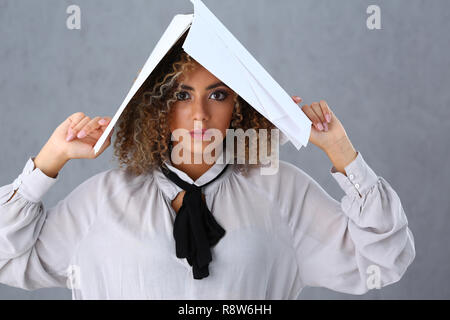 Beautiful black woman portrait. Holds paper documents Stock Photo