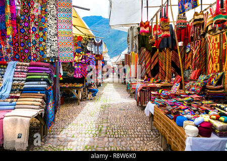 Market with colourful traditional Peruvian textiles in Pisac, Sacred Valley, Peru Stock Photo