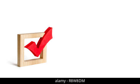 red wooden checkmark for voting on elections on a white background. Presidency or parliamentary elections, a referendum. Survey of the population, sta Stock Photo