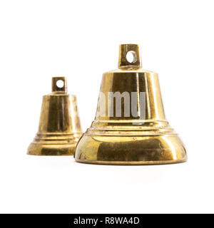 Two bronze hand bells isolated on white Stock Photo