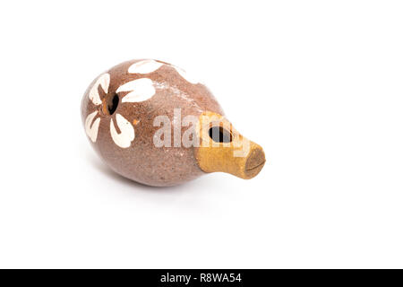 Hungarian folk wind musical instrument, ocarina, made from clay, isolated on white Stock Photo