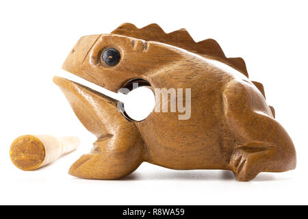 Wooden frog. Musical instrument made of wood. Stick and frog with teeth ...