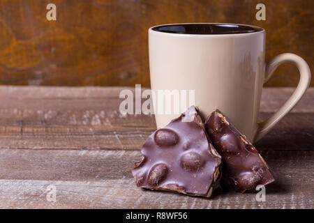 Big red mug and cookie on a blue background. Stock Photo