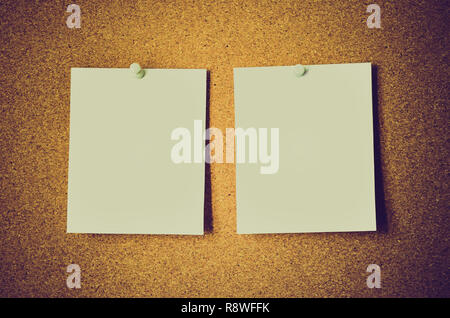 blank note papers on a cork board Stock Photo