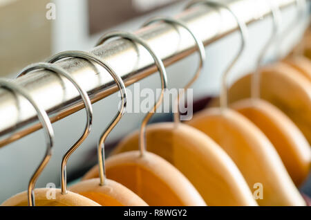 closeup of a lot of wooden hangers Stock Photo