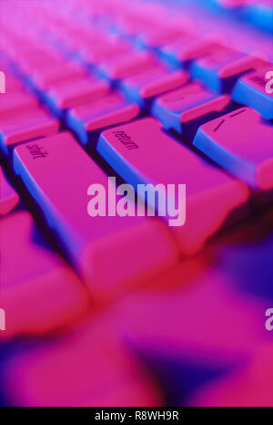 Colorful closeup of computer keyboard with the emphasize on the enter key Stock Photo