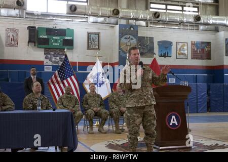 Sgt. Maj. of the Army (Ret.) Kenneth Preston, speaks during the Troops First Foundation’s Operation Proper Exit Hero’s Town Hall in the Area Support Group - Kuwait Morale Warfare Recreation gym in Camp Arifjan, Kuwait, on Mar. 14, 2017. Stock Photo