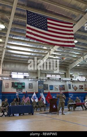 Sgt. Maj. of the Army (Ret.) Kenneth Preston, speaks during the Troops First Foundation’s Operation Proper Exit Hero’s Town Hall in the Area Support Group - Kuwait Morale Warfare Recreation gym in Camp Arifjan, Kuwait, on Mar. 14, 2017. Stock Photo