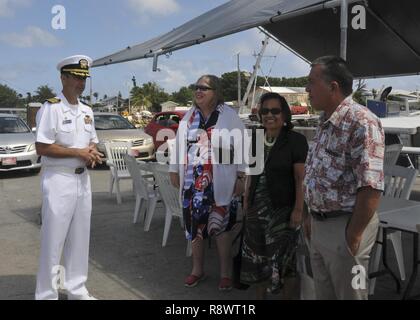 MAJURO, Republic of the Marshall Islands - Capt. Drew St. John, commanding officer of the submarine tender USS Frank Cable (AS 40), meets U.S. Ambassador to the Republic of the Marshall Islands Karen B. Stewart, President Hilda C. Heine of the Republic of the Marshall Islands and John M. Silk, Marshall Islands minister of Foreign Affairs in Majuro, March 15. Frank Cable, enroute to Portland, Ore. for her dry-dock phase maintenance availability, conducts maintenance and supports submarines and surface vessels deployed to the Indo-Asia-Pacific region. Stock Photo