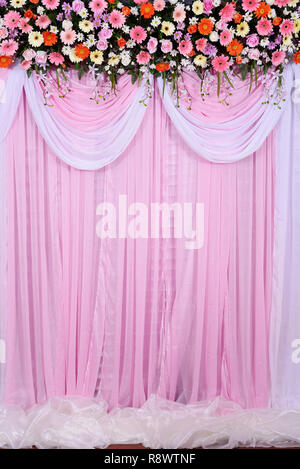 wedding scene, beautiful background made from fabric and flowers decoration in wedding ceremony Stock Photo