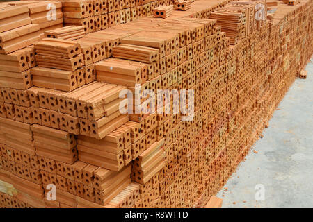Stack of red bricks, bricks used for building construction Stock Photo