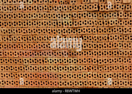 Stack of red bricks, bricks used for building construction Stock Photo
