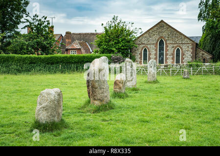 Neolithic stone circles and meadow with sheep grazing in the village of Avebury, Wiltshire, England, Europe. Stock Photo