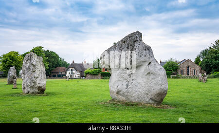 Neolithic stone circles and meadow with sheep grazing in the village of Avebury, Wiltshire, England, Europe. Stock Photo