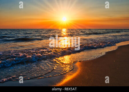 sunset on the beach sunrays Stock Photo