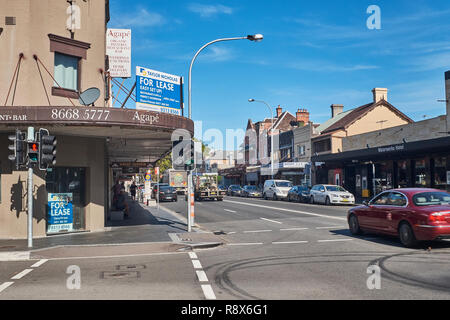 View of a cross roads on Botany Road in Botany on an autumn day with shops on each side of the road including a shop that is up for lease, Australia Stock Photo