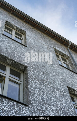 Tenant house in Łódź, Poland covered with glass  shards of a mirror. Rose's Passage. Stock Photo